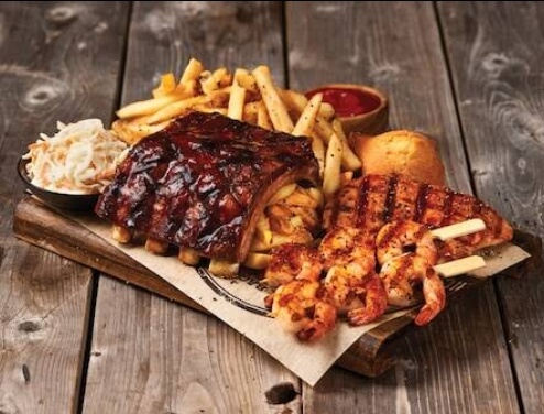 BBQ ribs, grilled shrimp, fries, and coleslaw at Montana’s BBQ &amp; Bar in Halifax.